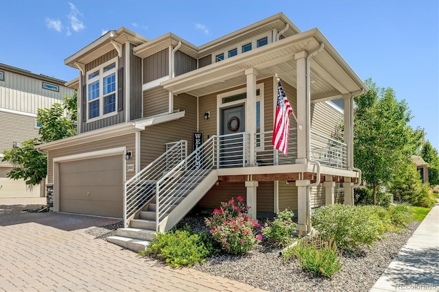 view of front facade with a garage and covered porch