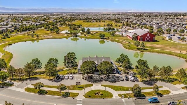 drone / aerial view with a residential view and a water view