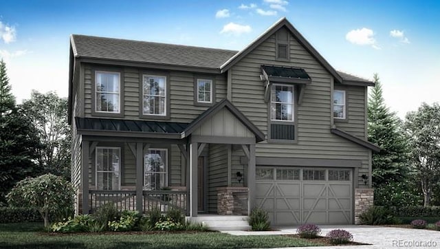 view of front of home with metal roof, an attached garage, stone siding, driveway, and a standing seam roof