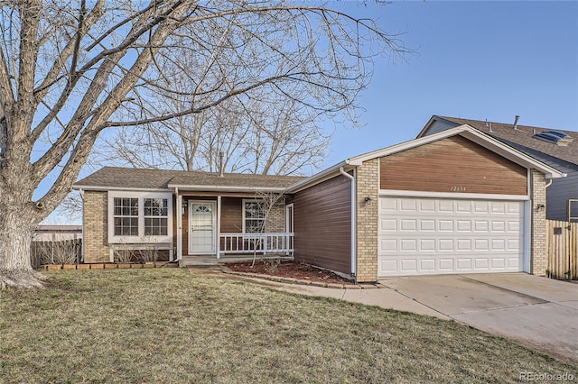 single story home featuring a garage and a front lawn