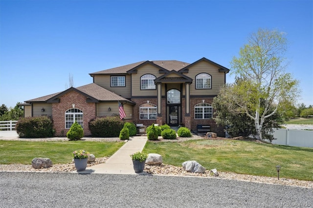 14953 Akron Ct, Brighton, CO 80602 - traditional home with brick siding and roof with shingles