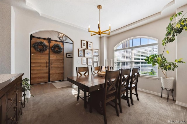 14953 Akron Ct, Brighton, CO 80602 - dining area with a chandelier, a raised ceiling, and baseboards