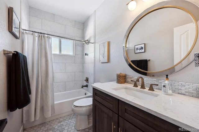 14953 Akron Ct, Brighton, CO 80602 - full bathroom featuring toilet, vanity, shower / bath combo with shower curtain, and decorative backsplash
