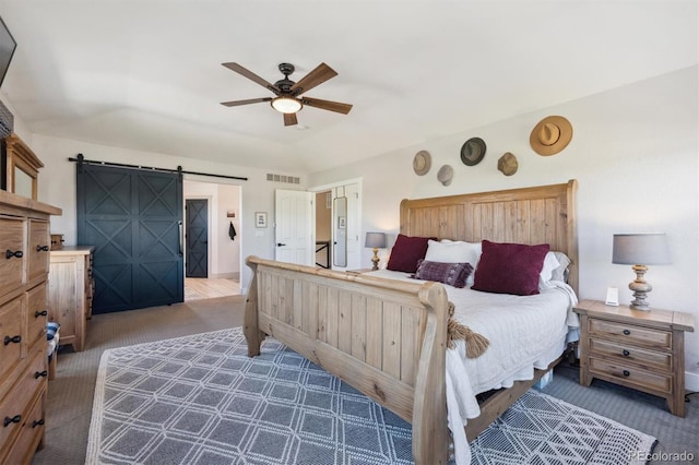 14953 Akron Ct, Brighton, CO 80602 - carpeted bedroom with a barn door and ceiling fan
