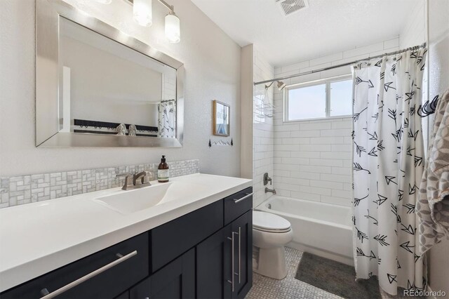 14953 Akron Ct, Brighton, CO 80602 - bathroom with shower / bath combo, toilet, vanity, and tile patterned floors