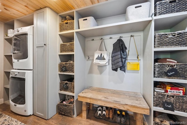 14953 Akron Ct, Brighton, CO 80602 - mudroom with estacked washer and dryer, wood ceiling, and wood finished floors