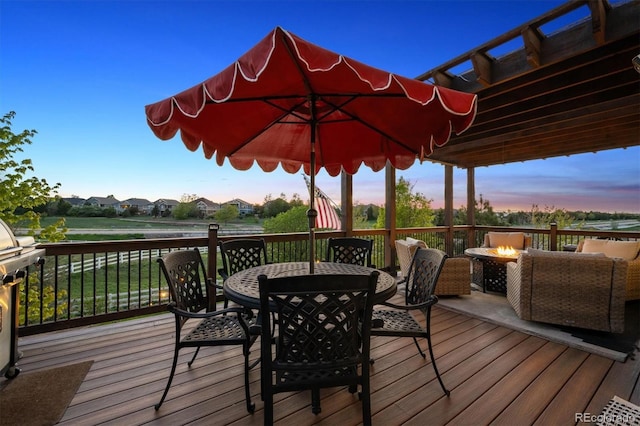 14953 Akron Ct, Brighton, CO 80602 - deck featuring outdoor dining area and an outdoor living space with a fire pit