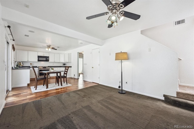 4435 Andes Ct, Denver, CO 80249 - carpeted living area with a ceiling fan, baseboards, stairs, and wood finished floors