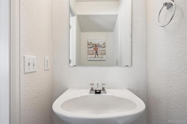 4435 Andes Ct, Denver, CO 80249 - bathroom featuring a sink and a textured wall