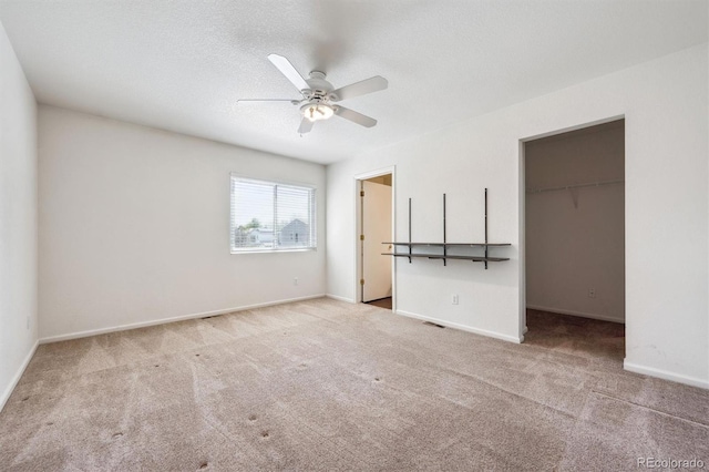 4435 Andes Ct, Denver, CO 80249 - unfurnished bedroom featuring carpet flooring, a spacious closet, baseboards, and a closet