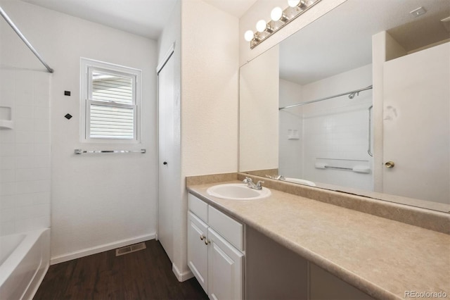 4435 Andes Ct, Denver, CO 80249 - bathroom with wood finished floors, vanity, and bathtub / shower combination
