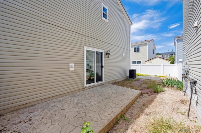 4435 Andes Ct, Denver, CO 80249 - rear view of property with fence, a patio, and central AC unit
