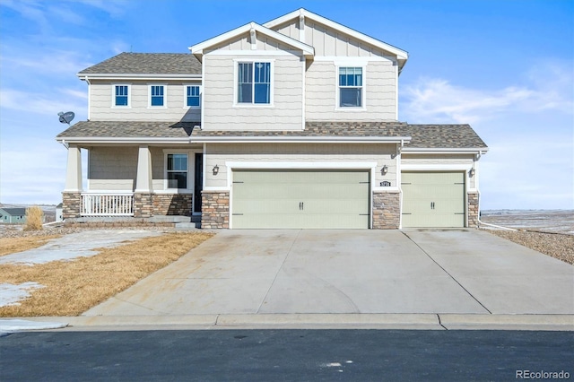 craftsman house featuring a garage and covered porch