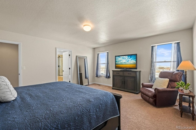 carpeted bedroom featuring a textured ceiling