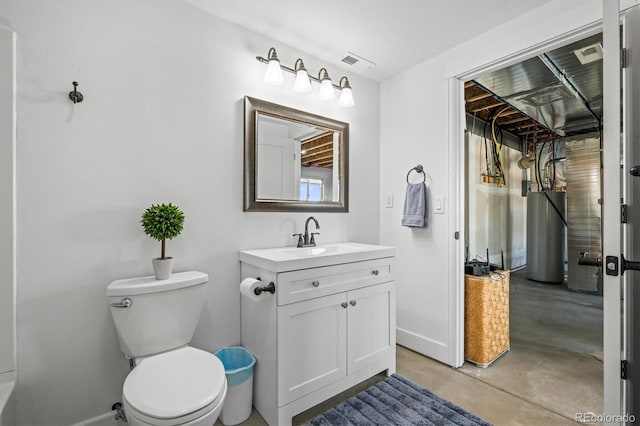 bathroom featuring toilet, concrete floors, and vanity