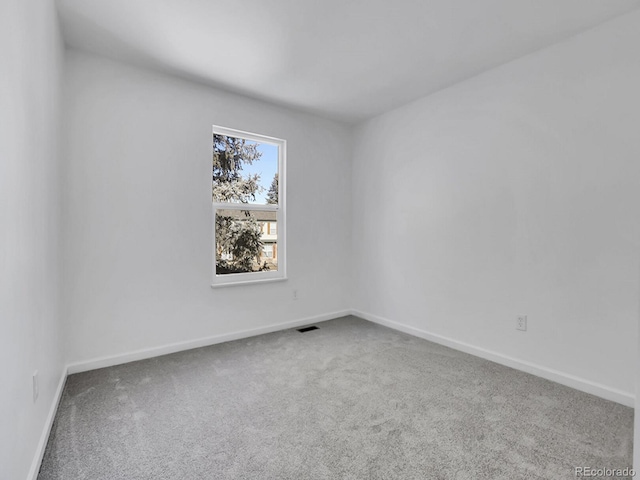 empty room featuring carpet flooring