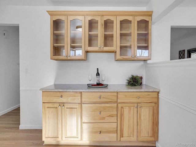 kitchen featuring light hardwood / wood-style floors and light brown cabinetry