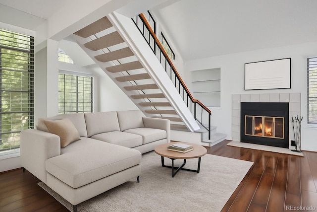 4802 E Kentucky Ave Unit E, Denver, CO 80246 - living room featuring dark wood-style floors, stairway, and a fireplace