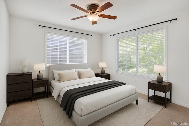 4802 E Kentucky Ave Unit E, Denver, CO 80246 - bedroom with light carpet, baseboards, and a ceiling fan