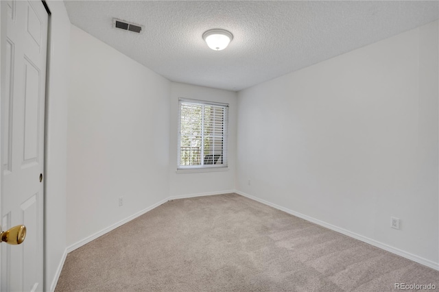 4802 E Kentucky Ave Unit E, Denver, CO 80246 - empty room with carpet flooring, a textured ceiling, and baseboards