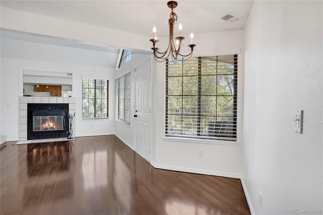 4802 E Kentucky Ave Unit E, Denver, CO 80246 - entrance foyer with a chandelier, healthy amount of natural light, and wood finished floors