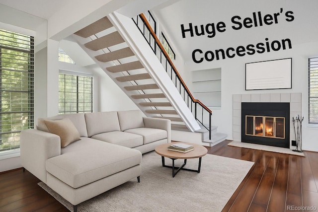 4802 E Kentucky Ave Unit E, Denver, CO 80246 - living area featuring dark wood-type flooring, stairway, and a fireplace