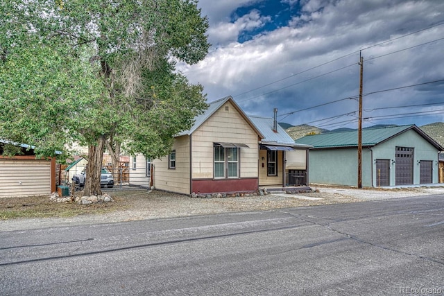 124 E 8th St, Salida, CO 81201 - view of front of property with metal roof and an outbuilding