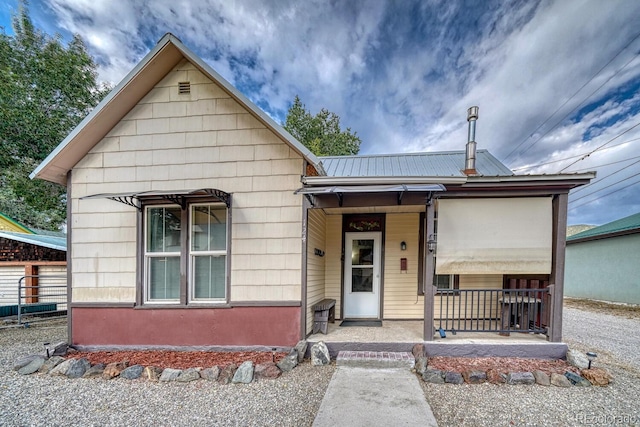 124 E 8th St, Salida, CO 81201 - view of front of house with metal roof and a porch