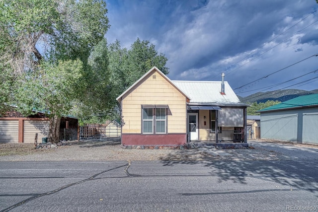 124 E 8th St, Salida, CO 81201 - view of front of house with fence and an outdoor structure