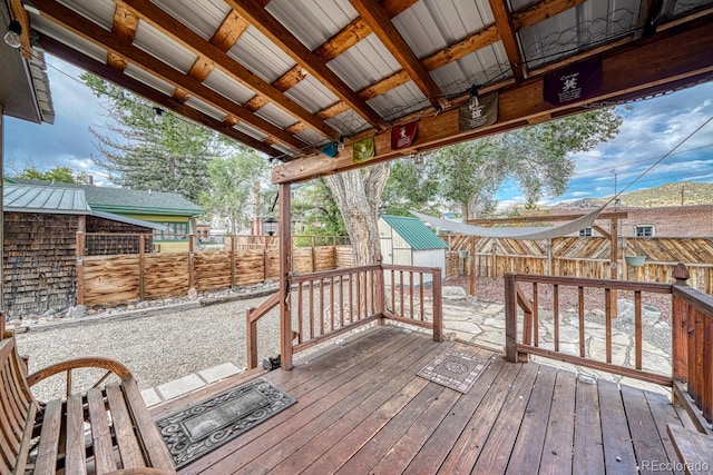 124 E 8th St, Salida, CO 81201 - wooden terrace featuring a fenced backyard, an outbuilding, and a shed
