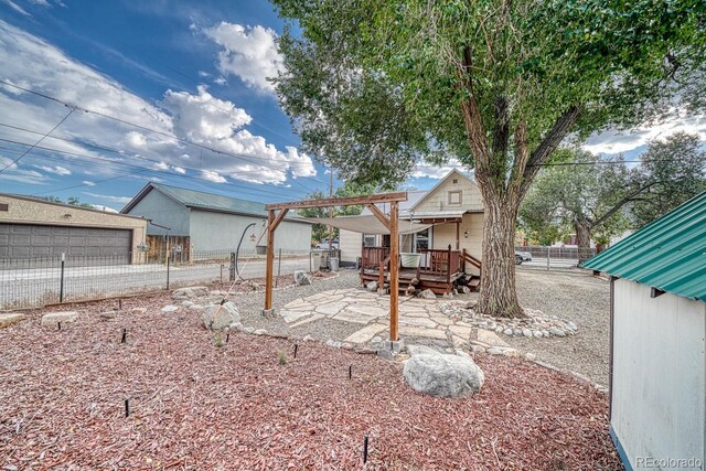124 E 8th St, Salida, CO 81201 - view of yard with a wooden deck and fence