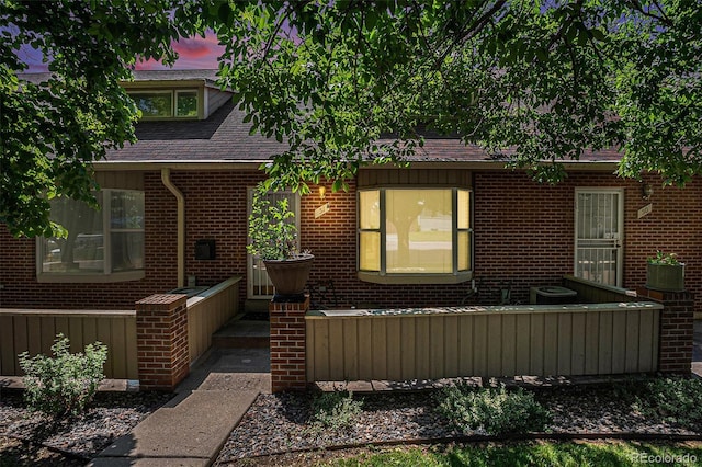 3300 W Florida Ave Unit 51, Denver, CO 80219 - view of front of house with a shingled roof and brick siding
