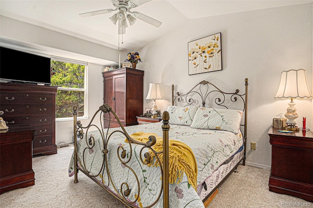 3300 W Florida Ave Unit 51, Denver, CO 80219 - bedroom with light carpet, lofted ceiling, baseboards, and ceiling fan