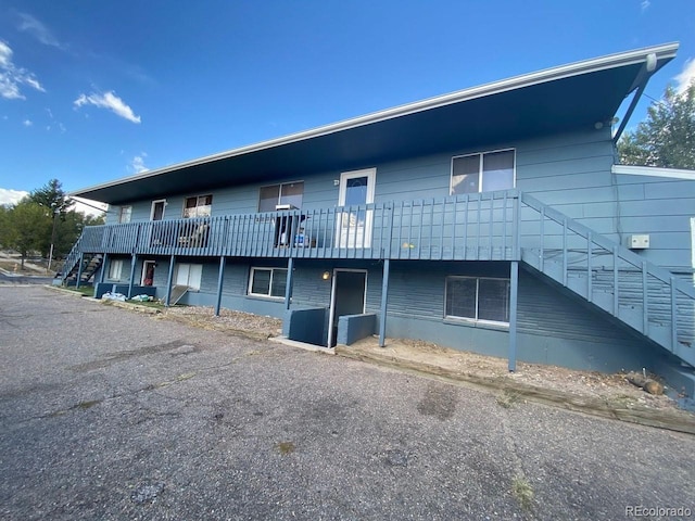 view of property featuring stairs