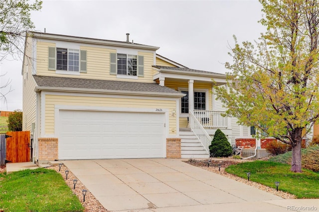 20626 Willowbend Ln, Parker, CO 80138 - split level home with fence, an attached garage, brick siding, covered porch, and driveway
