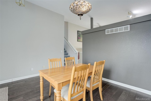20626 Willowbend Ln, Parker, CO 80138 - dining area featuring visible vents, baseboards, dark wood-style floors, and stairway