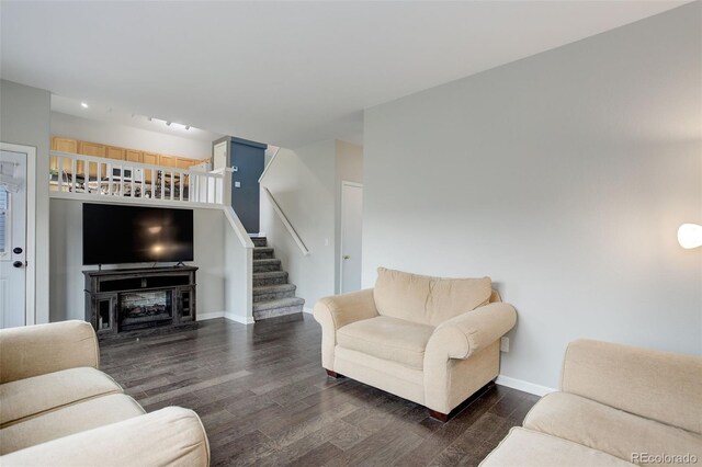 20626 Willowbend Ln, Parker, CO 80138 - living room with baseboards, wood finished floors, stairway, and a fireplace