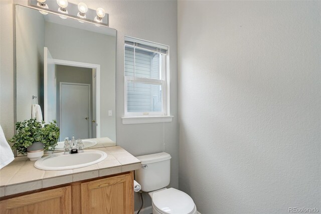 20626 Willowbend Ln, Parker, CO 80138 - bathroom featuring toilet and vanity