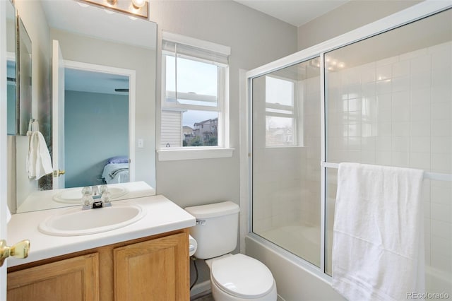 20626 Willowbend Ln, Parker, CO 80138 - ensuite bathroom featuring vanity, bath / shower combo with glass door, connected bathroom, and toilet