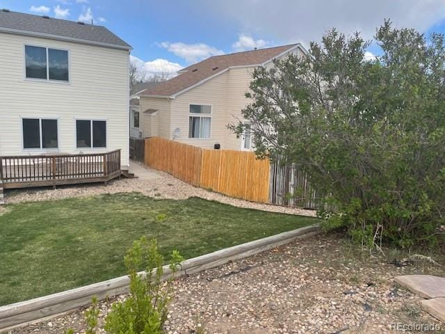 20626 Willowbend Ln, Parker, CO 80138 - rear view of house with fence, a lawn, and a deck