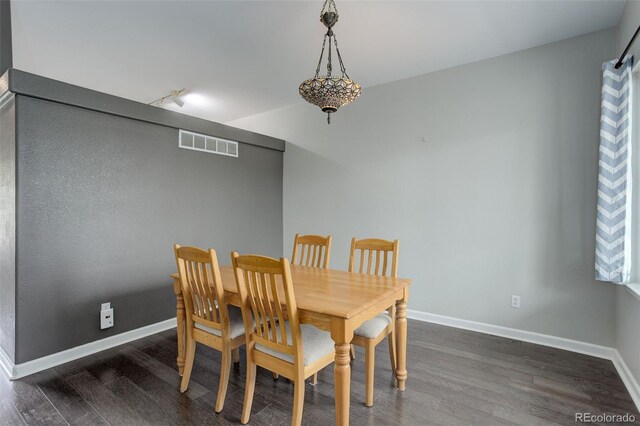 20626 Willowbend Ln, Parker, CO 80138 - dining space featuring visible vents, rail lighting, baseboards, and wood finished floors