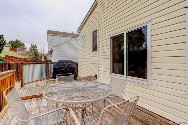 20626 Willowbend Ln, Parker, CO 80138 - deck with outdoor dining area and a grill