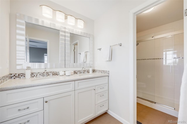 19294 E Warren Pl, Aurora, CO 80013 - full bathroom with tile patterned flooring, double vanity, and a shower stall