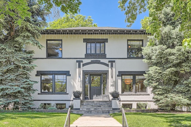 785 Fillmore St, Denver, CO 80206 - view of front of house featuring stucco siding and a front yard