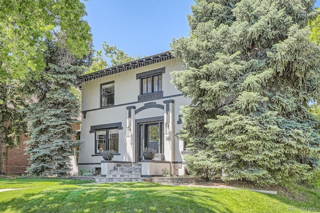 785 Fillmore St, Denver, CO 80206 - view of front of home featuring a front lawn and stucco siding