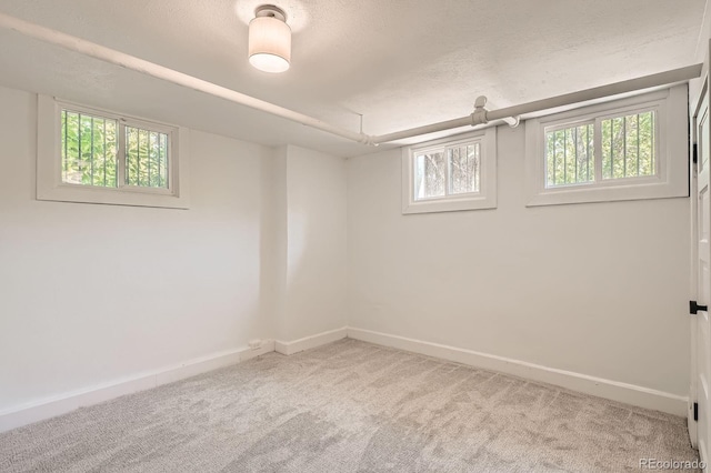 785 Fillmore St, Denver, CO 80206 - below grade area featuring carpet, baseboards, and a textured ceiling
