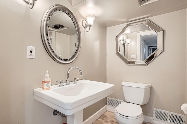 785 Fillmore St, Denver, CO 80206 - half bath with a sink, toilet, and baseboards