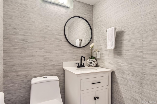 bathroom featuring vanity and toilet