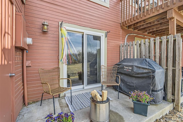 view of patio featuring fence and area for grilling