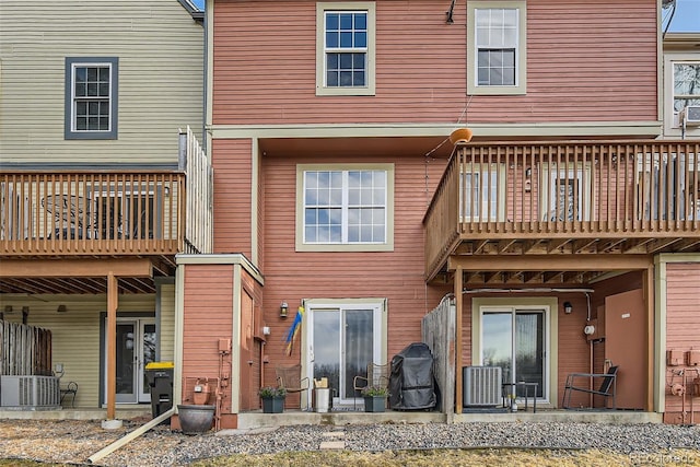 back of house featuring cooling unit